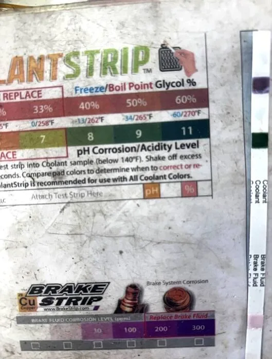 Coolant and brake fluid test strips used to check cooling system condition in Versailles, MO